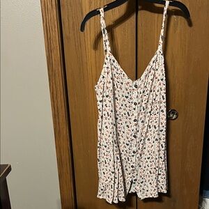 Cute adjustable strap cami blouse.
